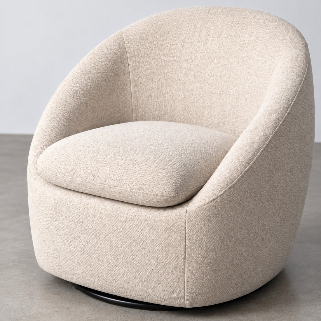 Detail of the seat and wraparound back of the Nolia armchair