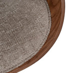 Edge of the upholstered seat next to the wood